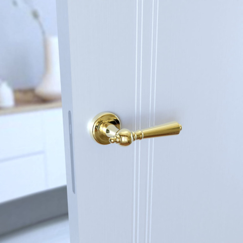 Klamka Millennium KMM G00 PVD złota na rozecie okrągłej Infinity Line