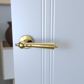 Klamka Millennium KMM G00 PVD złota na rozecie okrągłej Infinity Line