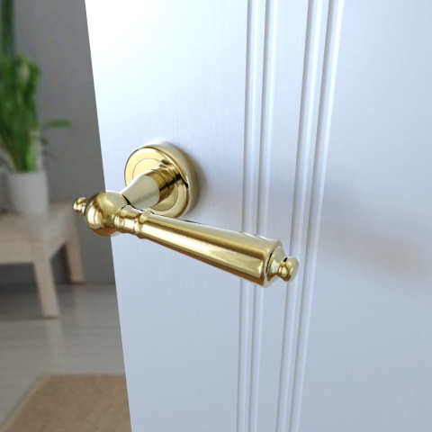 Klamka Millennium KMM G00 PVD złota na rozecie okrągłej Infinity Line