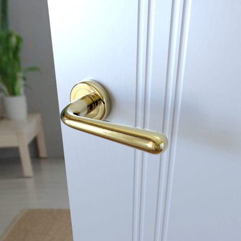 Klamka Lea KLE G00 PVD złota na rozecie okrągłej Infinity Line