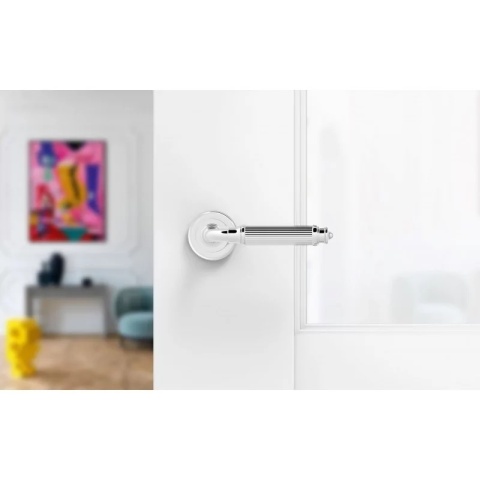 Klamka Aria R CL chrom błyszczący na rozecie okrągłej Corona