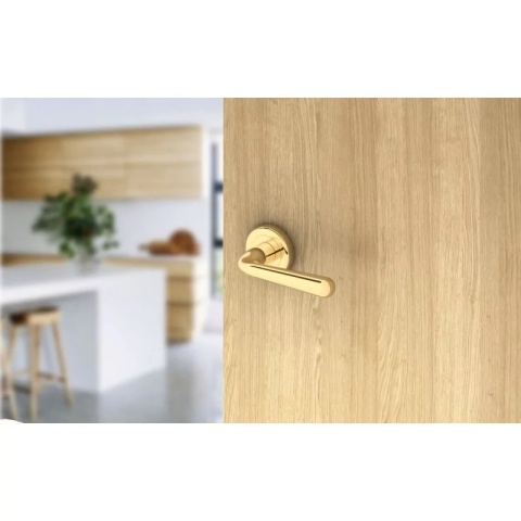 Klamka Handy R CL mosiądz błyszczący PVD na rozecie okrągłej Corona